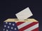3D rendered concept illustration of voting box with US flag painted on front and voting ballot in envelope in closeup