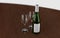 3d rendered wine bottle with empty glasses