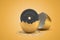 3d rendering of 25 kg weight plate hatching out of golden egg on yellow background