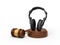 3d rendering of black headphones standing upright on sounding block with judge gavel beside.