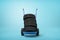 3d rendering of black vehicle tires on a hand truck on blue background