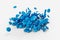 3D rendering of blue coated chocolate candy gems floating on an empty white background