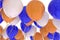 3D rendering of blue, orange, white balloons on white background