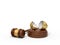 3d rendering of broken golden eggshell on round wooden block and brown wooden gavel