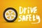 3d rendering of car wheel and white title `Drive safety` on amber background.