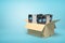 3d rendering of cardboard box full of several ATM`s on blue background.