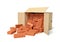 3d rendering of cardboard box lying sidelong full of new brown perforated bricks.