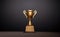 3d rendering champion golden trophy placed on table