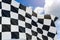 3D rendering of checkered race flag design waving on sky