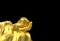 3d rendering. Chinese golden hand holding a gold ole money statue with clipping path isolated on black background.