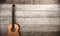 3d rendering classical guitar near wooden wall