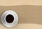 3D rendering coffee cup with brown fabric on wood table
