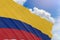 3D rendering of Colombia flag waving on blue sky background