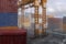 3D rendering of docklands shipping container yard with railway track and crane