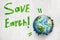 3d rendering of earth globe breaking white wall with green `Save Earth` sign