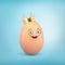 3d rendering of an egg with a smiley cartoon face wearing a crown.