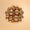 3d rendering of floating polished glossy and mat gold spheres on beige background. Abstract geometric composition. Group of balls