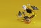 3d rendering ghost, witch, pumpkin,bat happy arround black giftbox explored on yellow background