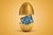 3d rendering of gold egg cracked in two, upper half levitating in air, plastic credit card on green grass in lower half.