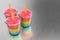 3d rendering of a group of rainbow pudding popsicles with glass