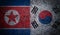 3D Rendering of Grunge Dual Flags of North Korea and South Korea on Concrete Wall