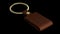 3d rendering of House key in an old leather keychain brown color