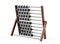 3D rendering illustration of a Ancient Suanpan Chinese abacus with metal rods and unions, wooden structure and movable beads for