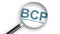 3D rendering illustration of BCP, business continuity planning,  word under magnifying glass
