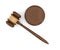 3d rendering of an isolated dark wood judge gavel and sound block in top view.