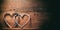 3d rendering joined hearts on wooden background