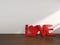 3D Rendering Love Text in a room with white wall,Valentine`s day