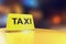 3d rendering of luminous neon light yellow taxi sign on the roof