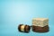 3d rendering of masonry work on round wooden block and brown wooden gavel on blue background