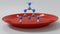 3d rendering of melamine molecules and red plastic plate.