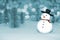 3D Rendering : merry christmas snow man doll on perspective snowscape sparkling bokeh wall light and christmas tree in background