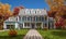 3d rendering of modern classic house in colonial style in autumn day