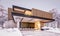 3d rendering of modern house with wood plank facade in winter evening