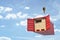 3d rendering of open red cargo container full of cardboard packages, suspended from crane.