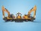 3D rendering orange construction machinery multifunction tractor and crawler excavator on blue background with shadow