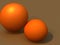 3d rendering of a pair of round oranges on a brown background