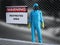 3D rendering of person in hazmat suit in restricted area