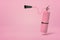 3d rendering of pink fire extinguisher suspended in air on pink background with copy space.