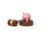 3d rendering of pink piggy bank standing on sounding block with gavel lying beside.