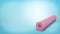 3d rendering of a pink rubber yoga mat closed and rolled up for storage lying on blue background.