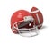 3d rendering of a red American football helmet lying near a red oval ball on a white background.