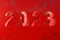 3D rendering of a red metal 2023 number on rusty background