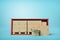 3d rendering of red open side shipping container full of cardboard packages, standing on light blue background, with 3