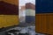 3D rendering of shipping containers stacked up in a docklands yard