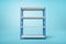 3d rendering of silver blue metal rack on blue background