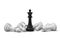 3d rendering of a single black chess king stands among many fallen white chess pieces.